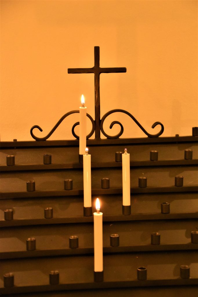 A cross with candles in a church